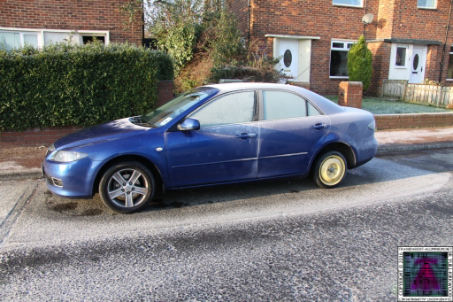 Mazda Ice with bicycle wheel
